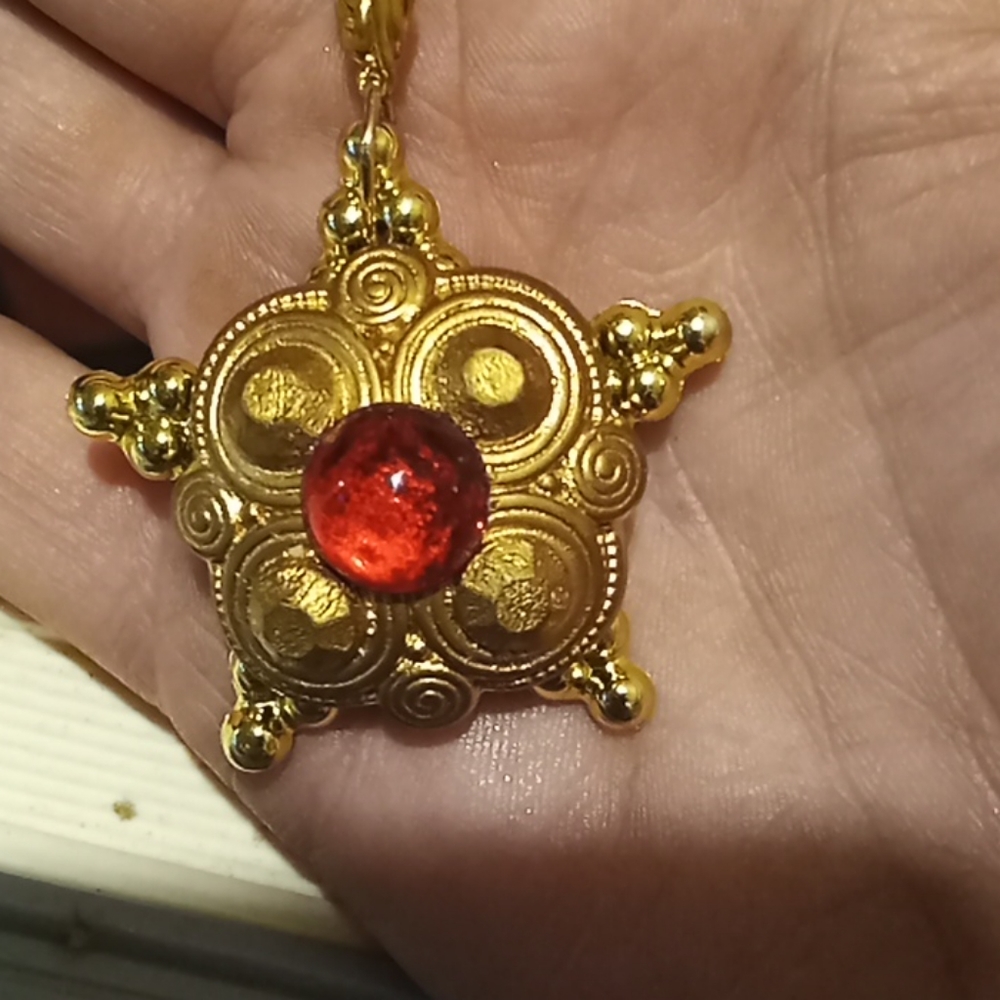 Gold colored star pendent